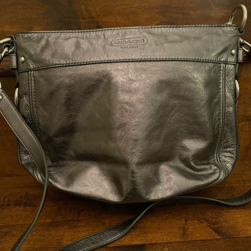 Leather Coach crossbody purse in a pewter color.
